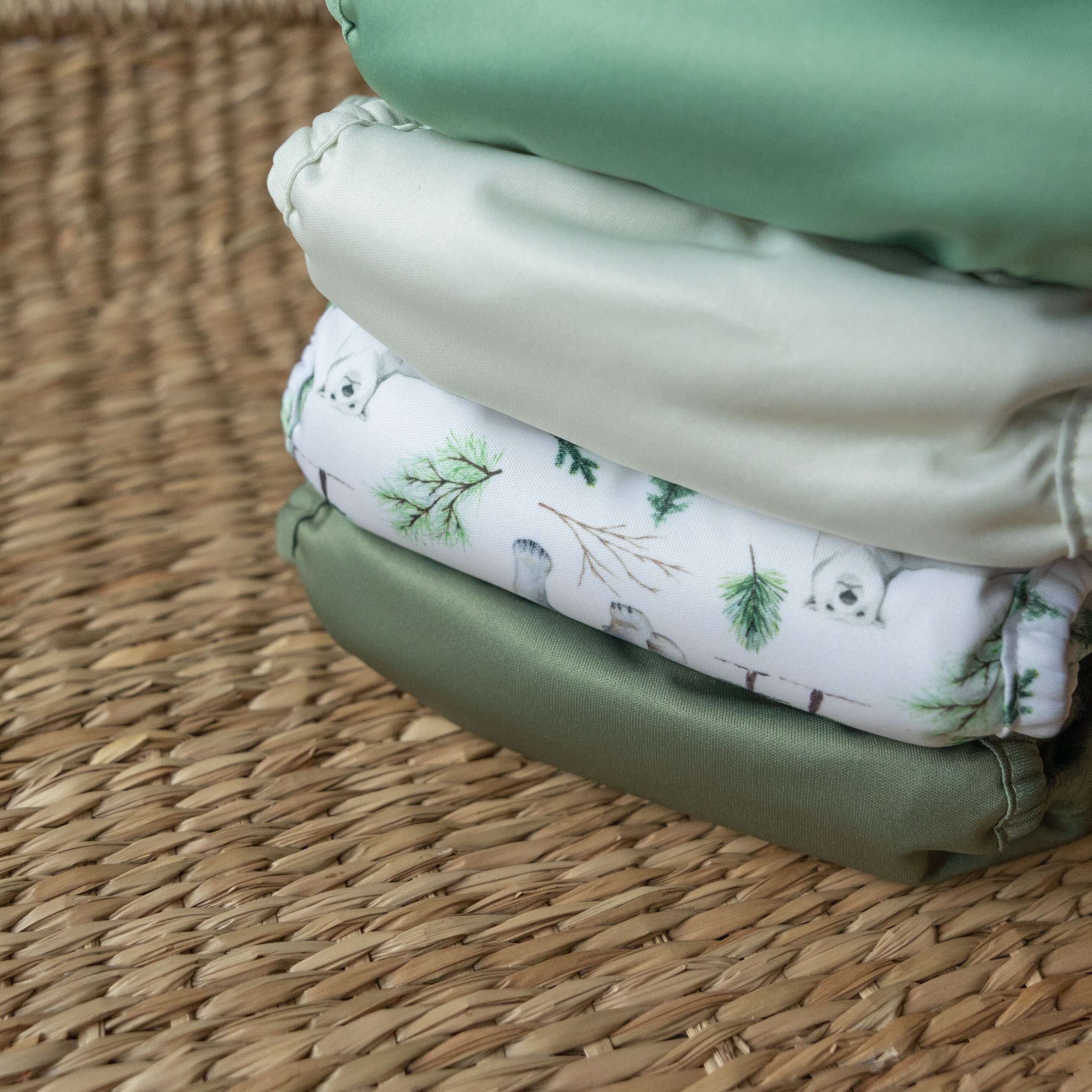 A wicker basket of folded Bayrli cloth diapers